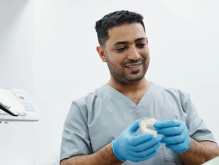 Illustrative photograph of a dentist explaining treatment
